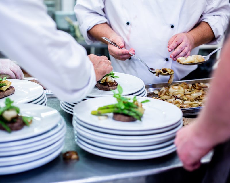 chefs preparing dishes